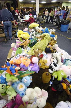 Stuffed toys are piled high in December 2006 at the Tommy Toy Fund distribution center at the Norwichtown Mall. The Toy Fund has helped about 100,000 young children in New London and Windham counties since its founding almost 35 years ago.