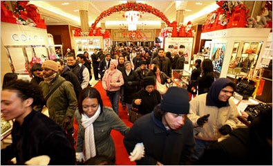 The first wave of shoppers rush into Macy’s in New York just after the doors opened at 5 a.m. But analysts said that over all there were more shoppers than bags.