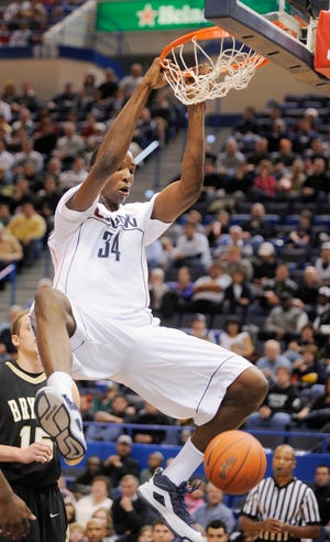 UConn center Hasheem Thabeet throws down a dunk Saturday during the Huskies’ 88-58 win over Bryant in Hartford.