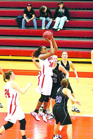 Tanesha Hughes scores in the lane during the Scots third place game win.