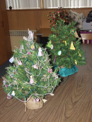 Miniature Christmas trees will be decorated at the Sherrard Public Library for Sherrard's Holiday celebration.