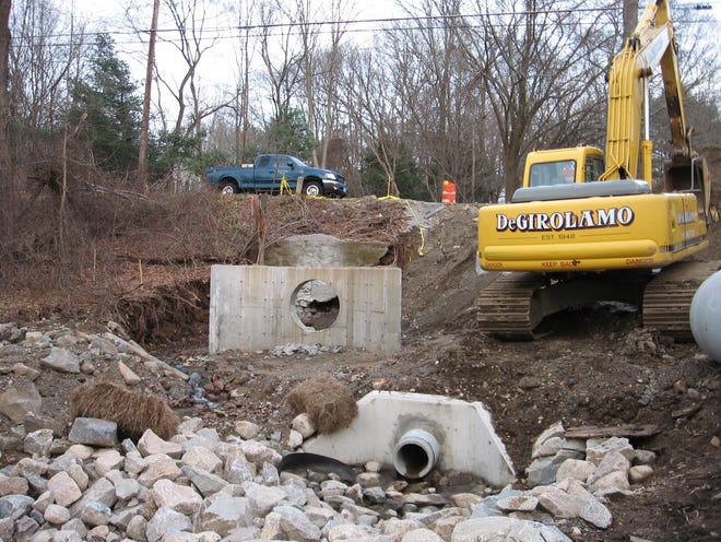 This culvert on Lincoln Street in Franklin is being shored up after a recent storm caused it to cave in.