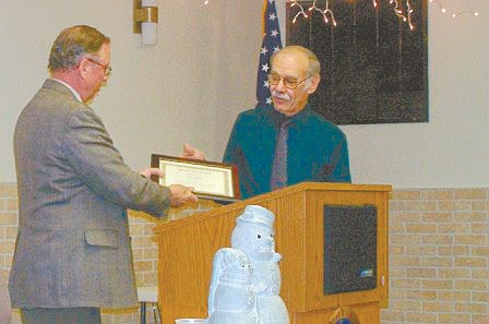 Les Allen presents Russ Mason with the 2008 Ag Service Award Wednesday at the 20th annual Warren-Henderson Farm Bureau meeting.