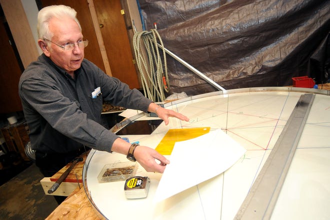 Stained glass artist Ted Gross of Freeport shows how he will create the stained glass star that will go into the Gold Star Memorial at All Veterans Memorial Park at his home Friday, Dec. 5, 2008.