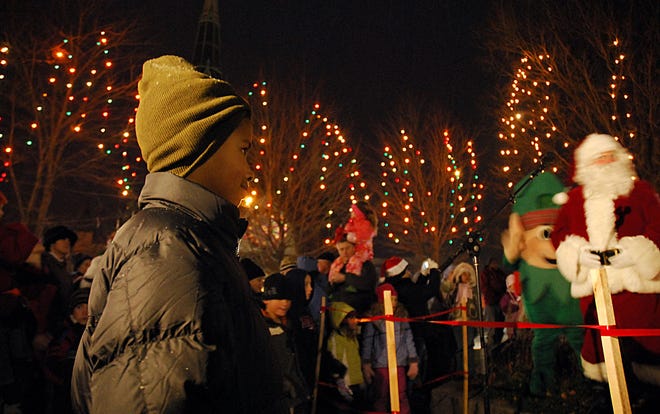 Kyle Griffin, 6, of Natick checks out the lit trees during Natick's annual holiday tree lighting last year.