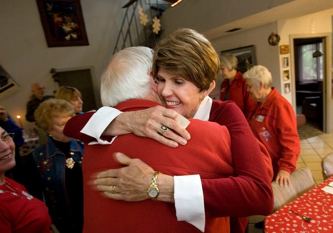 Carol Bard, a former principal, hugs a fellow Marion County School District retiree Tuesday at the annual<0x000A>"A Has-Been Christmas" breakfast at the southeast Ocala home of Chris Mendola, also a retired principal.