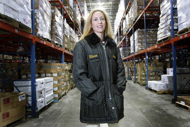 Karen Bressler, CEO of AGAR, a large distributor of food products throughout New England, stands in the warehouse. The company was founded by her grandfather.