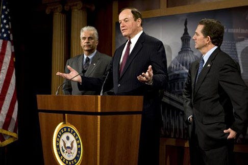 Sen. Richard Shelby, R-Ala., center, flanked by Sen. John Ensign, R-Nev., and Sen. Jim DeMint, R-S.C., talks to reporters on Capitol Hill in Washington, Wednesday, about Republican opposition to American automakers getting a financial deal from the White House and Democrats in Congress.