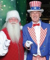 Santa joins Uncle Sam Rounseville on his billboard in Quincy