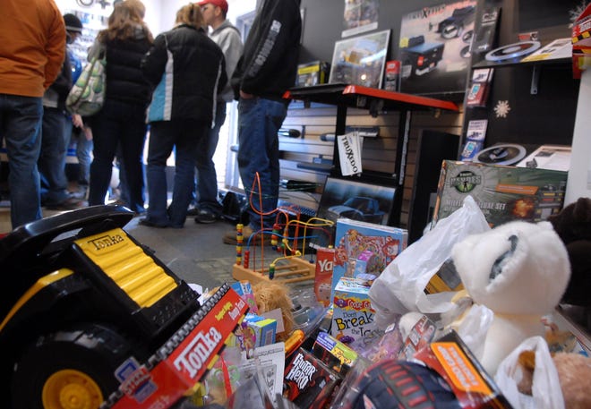 A collection of toys for Toys for Tots sits Saturday at Swift Motorsports on West Thames Street in Norwich.