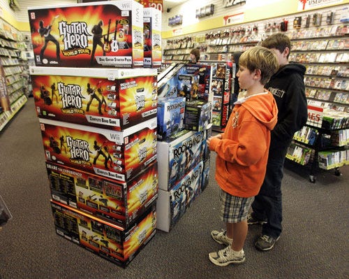 Guitar Hero and Rock Band 2 video game bundles are seen on display at a GameStop store in Redwood City, Calif., on Wednesday.