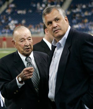 ** FILE ** In this Sept. 16, 2007 file photo, Detroit Lions owner and chairman William Clay Ford, left, talks with team president Matt Millen prior to their NFL football game against the Minnesota Vikings. The Lions are owned by the reclusive Ford, who has stayed quiet as his team has moved within a loss of being the NFL's first 0-15 team in 2008. (AP Photo/Paul Sancya, file)