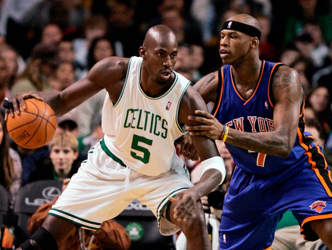 Boston Celtics' Kevin Garnett (5) looks to make a move on New York Knicks' Al Harrington in the first quarter of the NBA basketball game on Sunday at the TD BankNorth Garden.