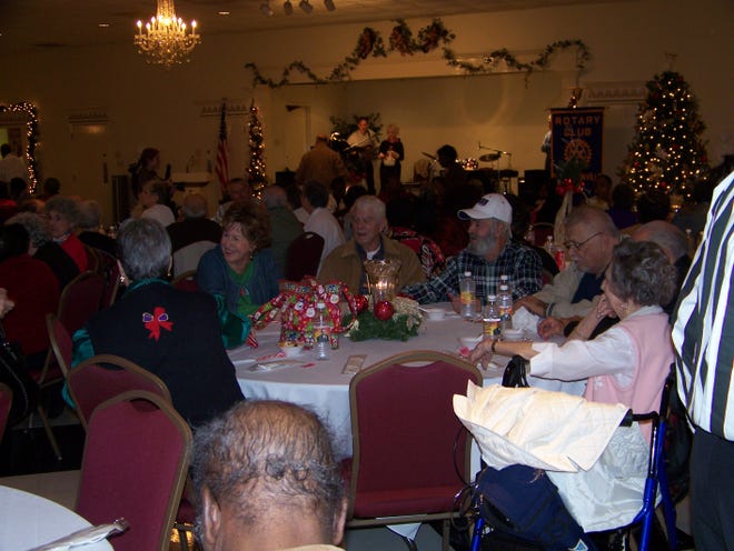Area seniors enjoy lunch and good conversation with friends at the Rotary luncheon last Tuesday.
