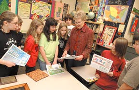Pearl City elementary teacher Jo Wenzel reads from Ag Mag to students in her fourth grade class Wednesday. Wenzel has been named Illinois Agriculture Teacher of the Year.