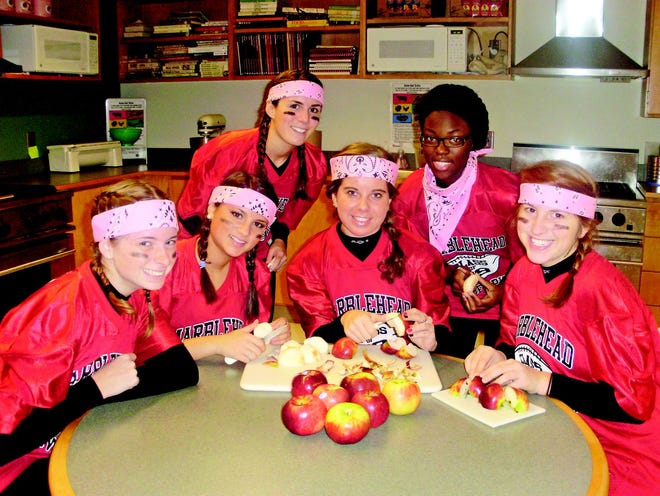 Shown are members of the winning Marblehead High School senior Powderpuff football team in Kathy Edwards Chef’s class. The Chef’s class Apple Crisp Fundraiser supports the Marblehead Food Pantry. Crosby’s Market Place donates the apples. From left, front row, Leah Femia, Kara Preston, Liz Akselrod and Ariel Yoffe. Back row, Samantha Smith and Wilesha Cineus.