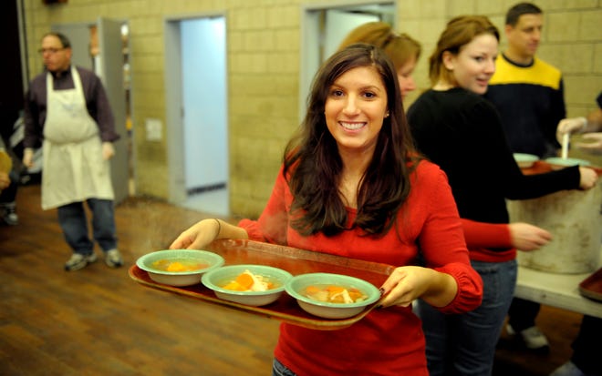 At the Salvation Army, Helene Trompeter of Atlanta, formerly of Framingham, was one of about 25 volunteers from Temple Beth Am serving Christmas meals to about 100 people.