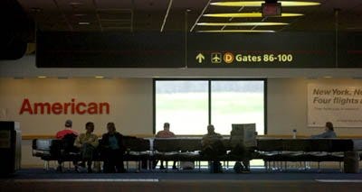 The Times/ LUCY SCHALY American Airlines passengers wait for their flights at Pittsburgh International Airport in this file photo. The airport is on pace to have its lowest number of passengers in its 16-year history.