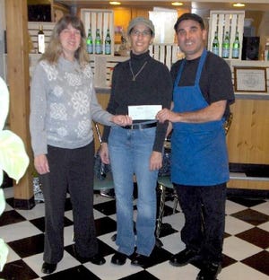 Greg and Lynn Giunta of Pocono Pasta in Stroudsburg present a $250 check for the United Way of Monroe County to Chris Grape-Garvey, left, community outreach and special events director for the United Way. The donation came from the recent grand opening of Pocono Pasta, a restaurant with an Italian market located on North Fifth Street. The contribution is going towards the 2008 campaign.