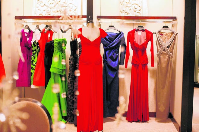 ASSOCIATED PRESS
Evening gown options for the inauguration hang inside a Neiman Marcus store 
in Washington, D.C., in December. A new Web site is helping women avoid the 
social catastrophe of showing up in the same dress as someone else by 
"registering" their inaugural dresses online to limit the chances of that 
happening.