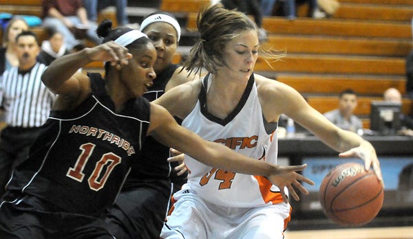 Pacific’s Emma Head drives past Cal State Northridge’s Tonicia Tademy on Friday at Spanos Center.