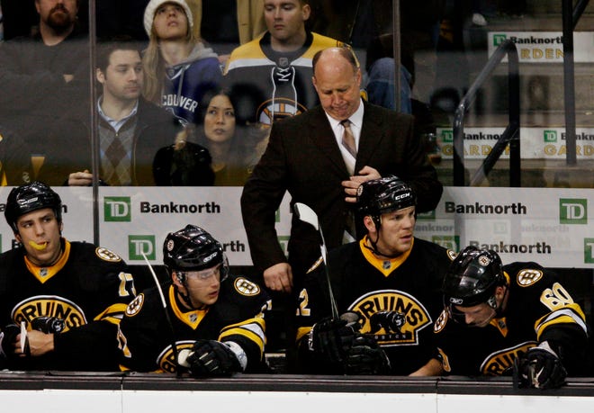 Bruins head coach Claude Julien reacts with his team on the bench during the final moments of their 4-2 loss to the Sabres on Saturday.
