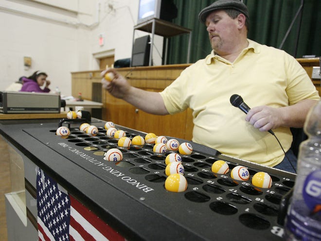 Dave LaChance calls out numbers during a bingo game at the Fruth Center in Brockton on Sunday to benefit Brockton Youth Hockey.