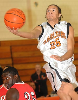 Marlborough's Keith Brown drives in for two of his 30 points in the Panthers' 70-68 win over Worcester South.