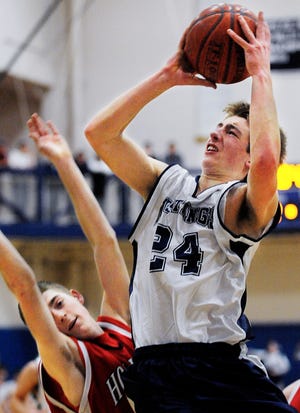 Medway's Matt Zajac goes up for a shot during the Mustangs' 65-54 win over TVL rival Holliston.