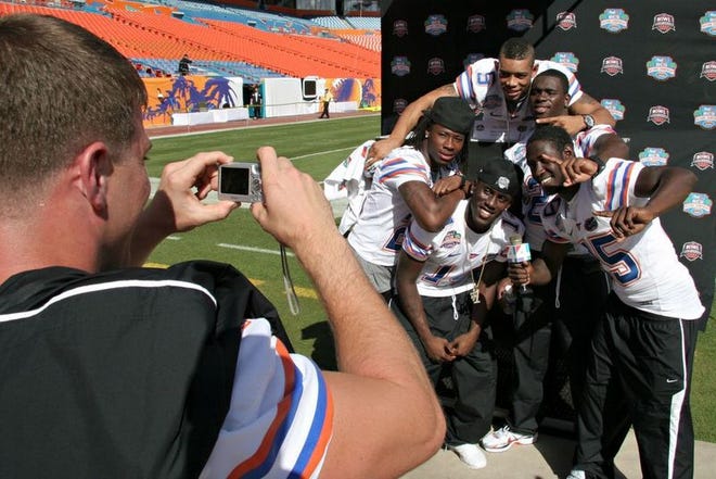Florida players crowd together for a photo during the wrap up of media day at the Dolphin Stadium in Miami Gardens, Fla. on Jan. 5, 2009.