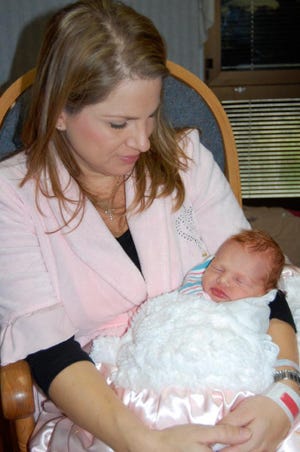 Elsa Gol holds Lilly Anna, who was born at 1:24 p.m. on New Year's Eve, 2008's last baby of the year at Baptist Medical Center-Beaches.