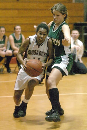 Carver guard Ally Thatcher drives past Abington defender Brittany Ezzell Tuesday night