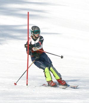 Inland Lakes’ Alexis Bigelow prepares to finish her first run of the slalom at Boyne Highlands, Harbor Springs during the Petoskey Invitational, Tuesday.