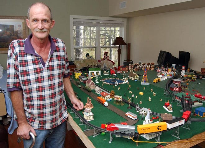 Harry Wingate, 51, is putting together a model train village in his room at Hospice of the Golden Isles in Bruns-wick, Ga., in hopes that the display will give his stepson something by which to remember him.TERRY DICKSON/The Times-Union