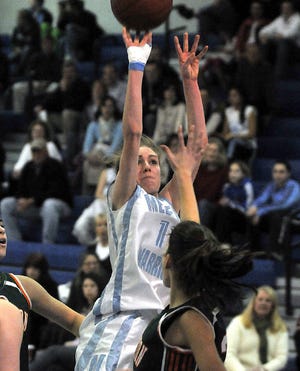 Medfield's Jen McBrien strokes a jump shot during the Warriors' victory over Hopkinton.