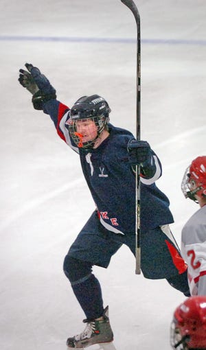 Pembroke's Tim Bruso (12) scores a goal in the first period to cut Silver Lake's lead to 2-1.