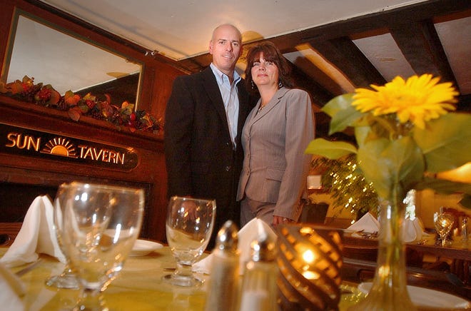 Duxbury residents John and Laurie Cowden in Duxbury's Sun Tavern in September 2007. The building dates to the 18th century. Just a few months afterward, things started to go downhill, and the restaurant is now closing.
