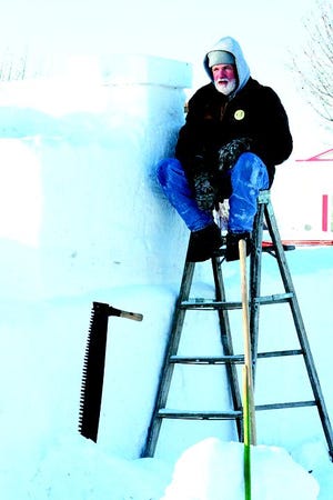 Larry Strouse of Carp Lake is sculpting the ship for this weekend's Winterfest event in Mackinaw City, which includes a snow sculpting competition. The sculpture will be eight feet wide and about 32 feet long when completed.