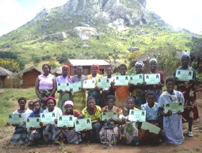 Provided by First Baptist Church of MandarinAnna Matwanje (standing, far left), vice persident of First Baptist Church of Mandarin's Mission Task Force, stands with women who have completed a literacy program in Malawi.