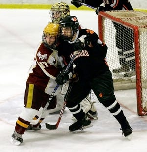 Marlborough's Corey Dobson (right) and Algonquin's Justin O'Connell fight for position in the crease on Friday.