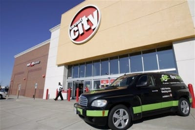 Shoppers walk out of a Circuit city store in Richmond, Va., on Friday.