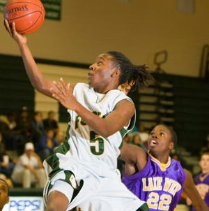 Forest’s Tony Oats drives to the basket as Lake Weir’s Radams Kennedy, left, defends Friday night at Forest High.