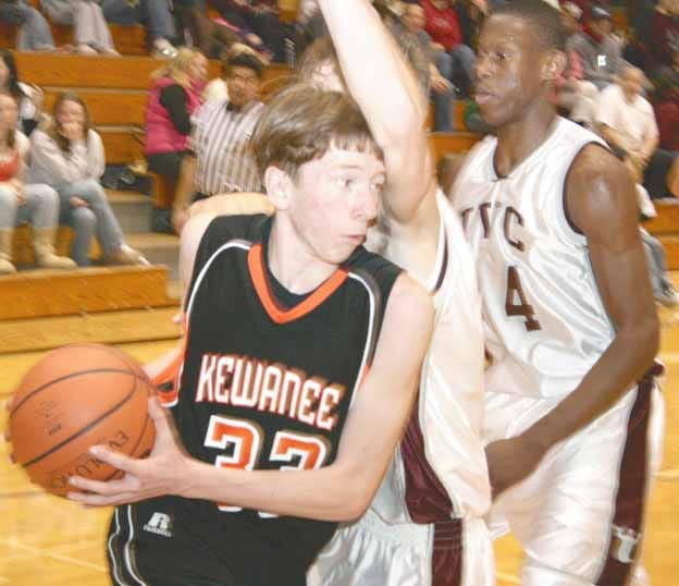 Kewanee’s Matt Carlson (33) has his baseline drive halted by the arm of an IVC defender during Friday night’s NCIC Lincoln contest.