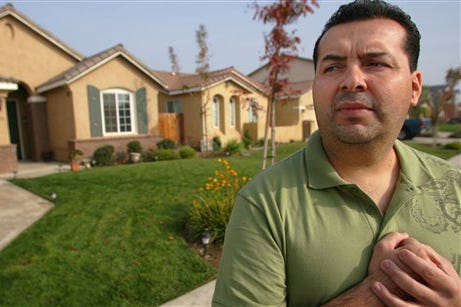 Joel Cazares poses for a photo outside his home in Visalia, Calif., Tuesday, Nov. 25, 2008. Cazares and his wife have spent months awaiting word on a loan modification, which they hope will bring their payment down from $2,500 to a more manageable level of around of $1,500.