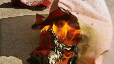 Oklahoma City bank robber drops money bag after dye pack explodes