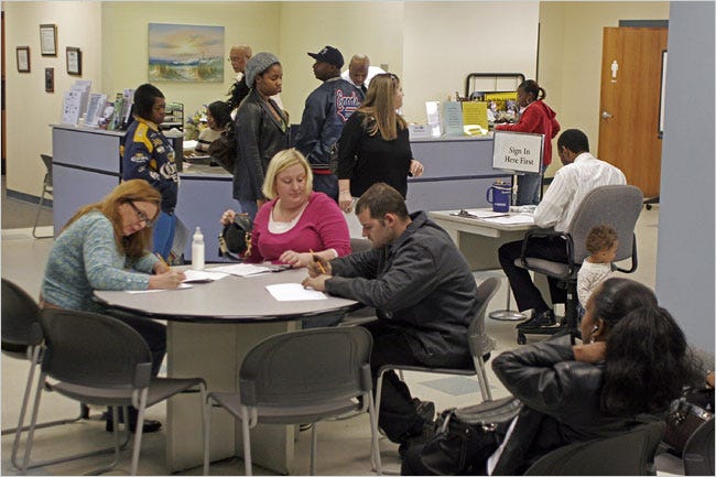 Residents of Columbia, S.C., visiting the employment security commission to seek jobs or file for unemployment benefits.