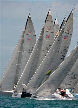In this photo released by the Florida Keys News Bureau, Farr 40-class sailboats cross the start line during the second of two races staged Monday, Jan. 19, 2009, at the Acura Key West sailing regatta in Key West, Fla.. Sailing is scheduled to continue through Friday, Jan. 23. More than 150 boats, in 13 classes, are competing off the Florida Keys.