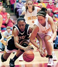 Iowa State's Nicky Wieben, right, and Missouri's Shakara Jones compete for a loose ball during the second half of the Cyclones' 65-42 victory last night.
