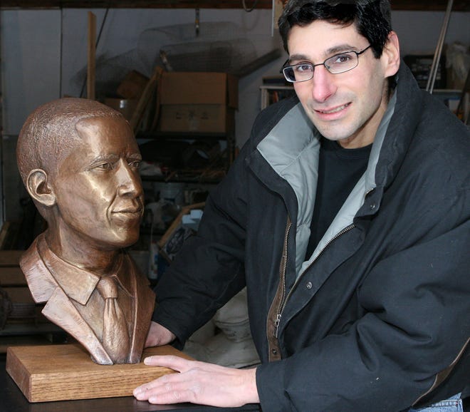 Hopkinton artist Michael Alfano shows his sculpture of President Barack Obama.
