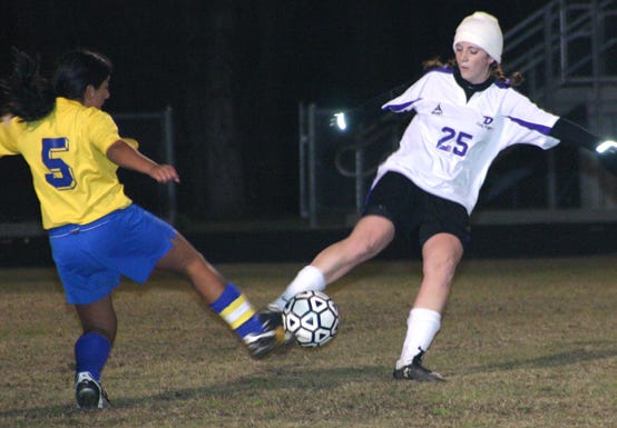 Dutchtown’s Lindi Robicheaux battles East Ascension’s Claudia Flores for possession in the first half of the Lady Griffins’ 3-0 victory Tuesday night.